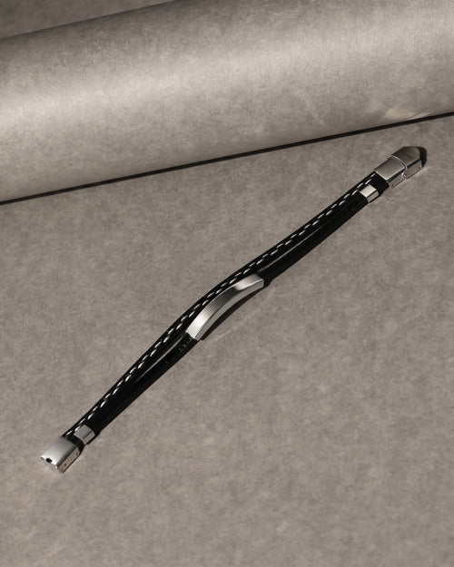 Black multi-strand leather bracelet with silver-tone bars