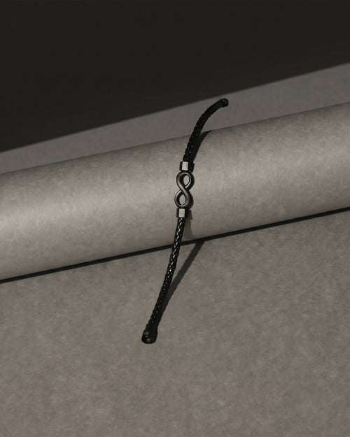 Black braided leather infinity symbol bracelet