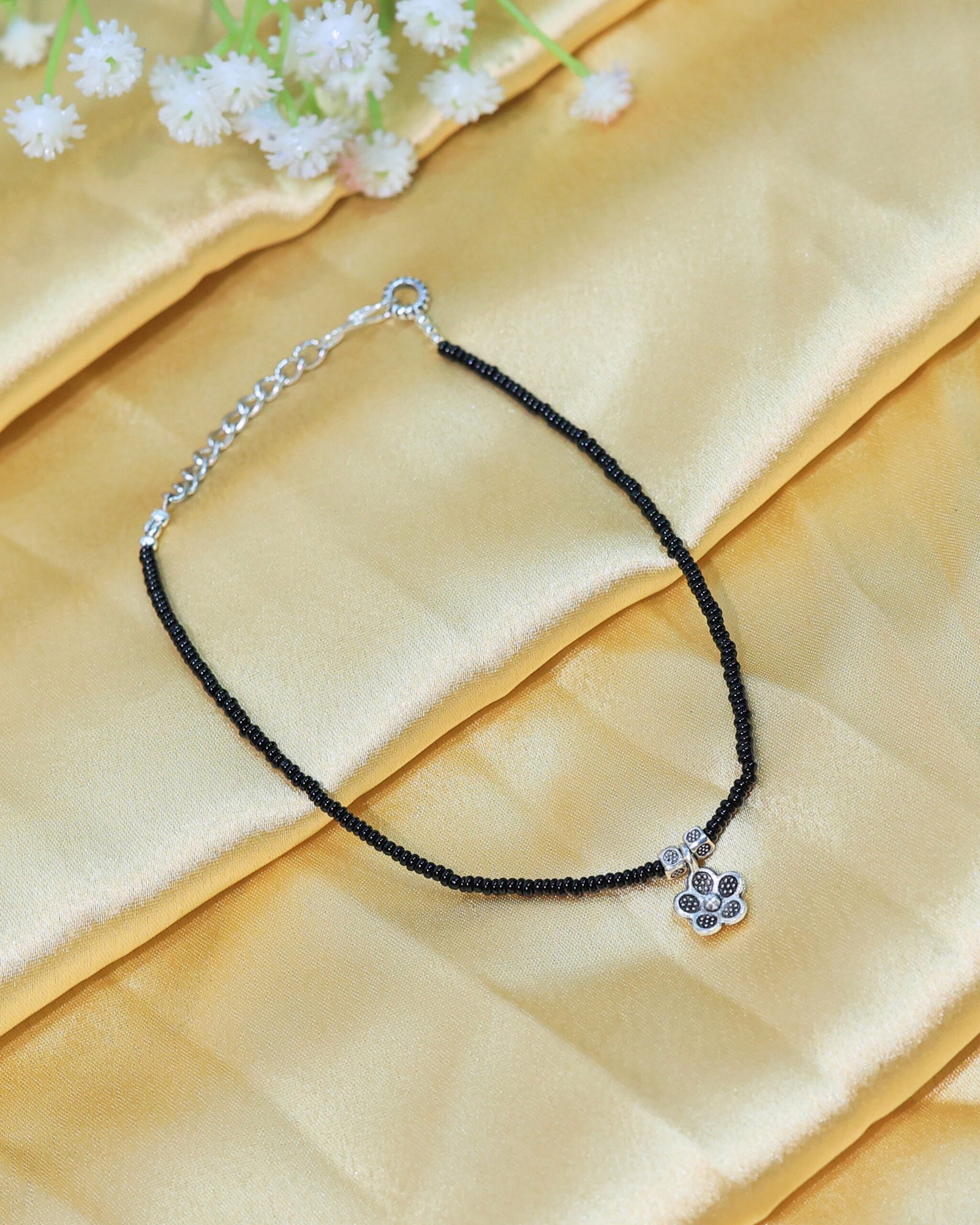black beaded flower charm anklet black beaded flower charm anklet
