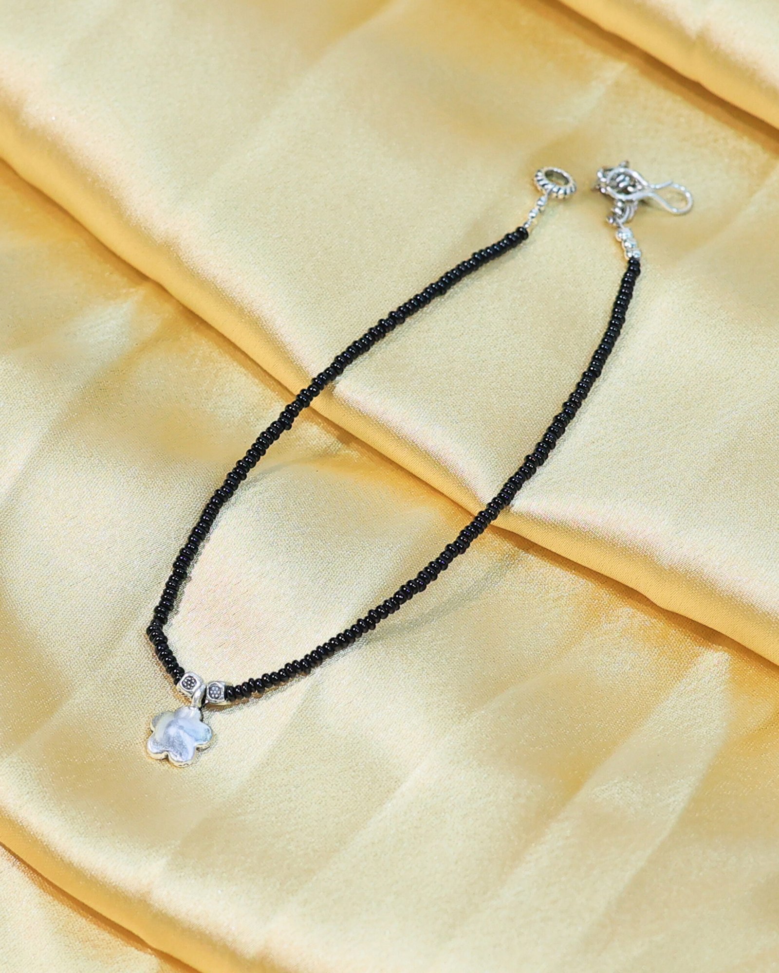 black beaded flower charm anklet black beaded flower charm anklet